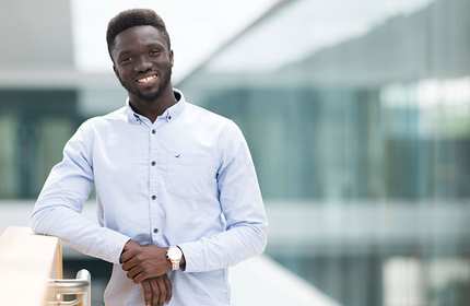 Liyechtan Soro leans on a staircase rail