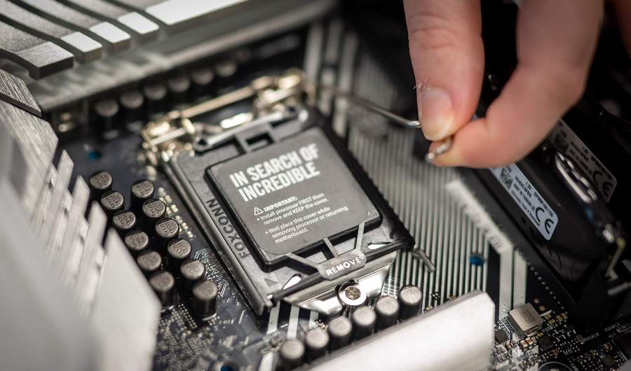 A processor being fitted to computer motherboard.