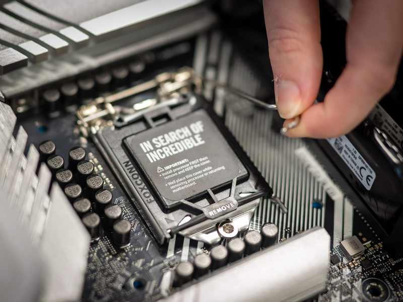 A processor being fitted to computer motherboard.