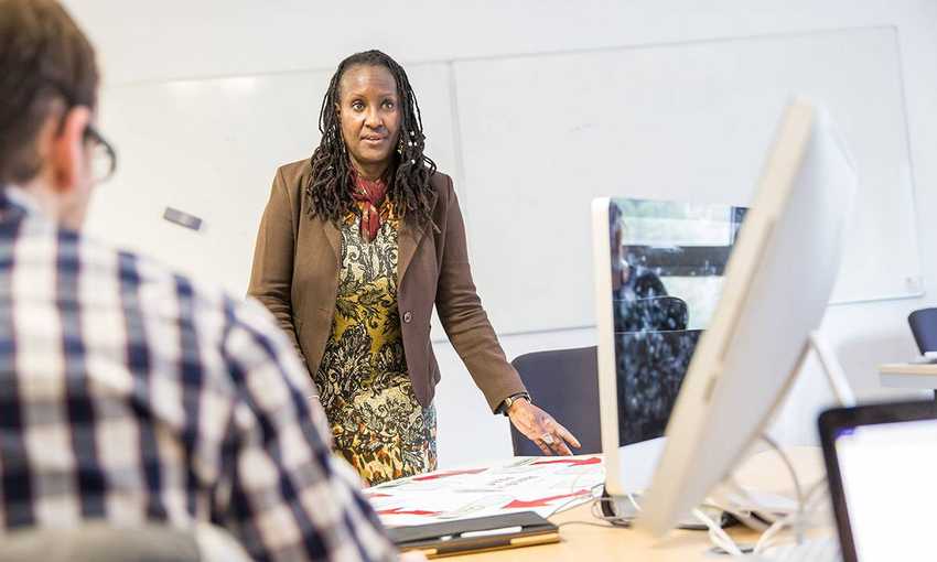 Member of staff presents information to students