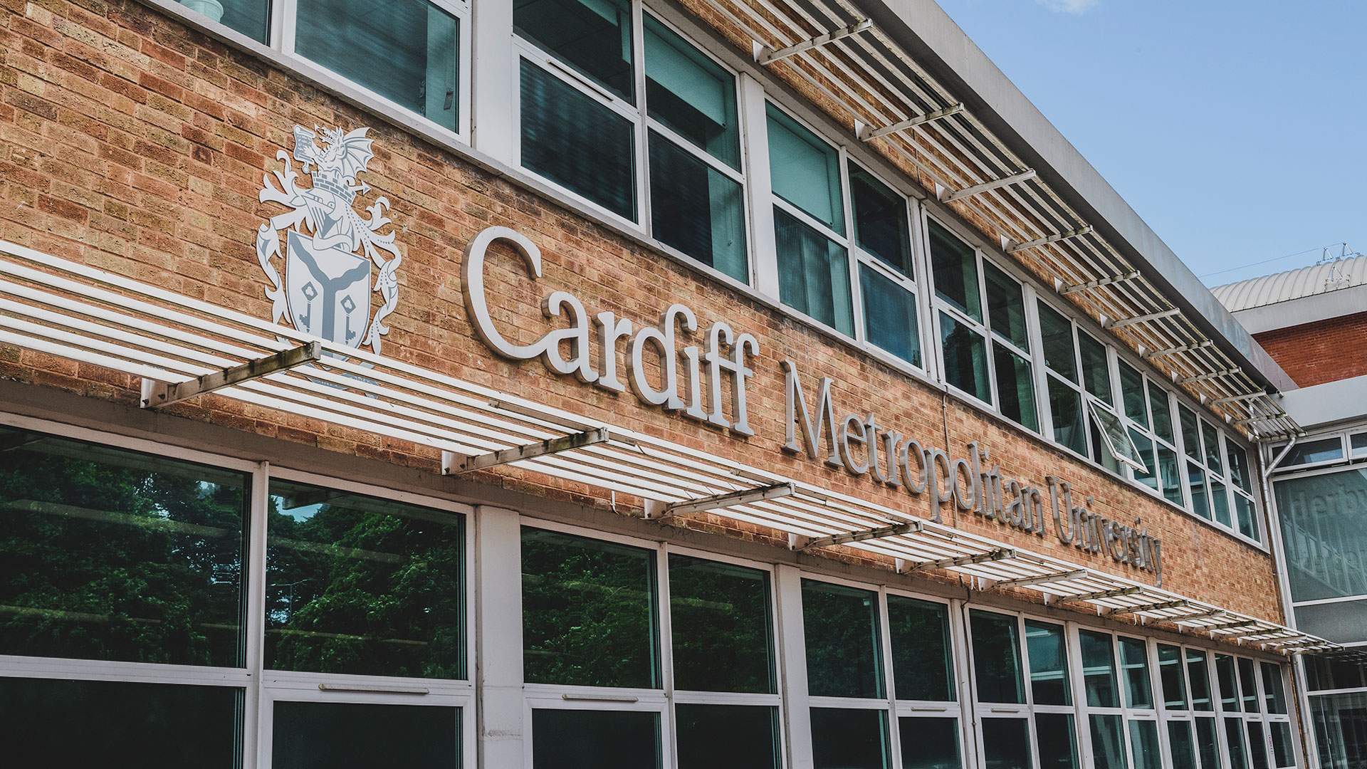 Exterior shot of Cardiff Metropolitan University's new building, highlighting its contemporary architecture and integration with the campus environment.