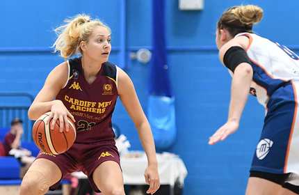 Cardiff Met Archers student player dribbles with a basketball against an opponent